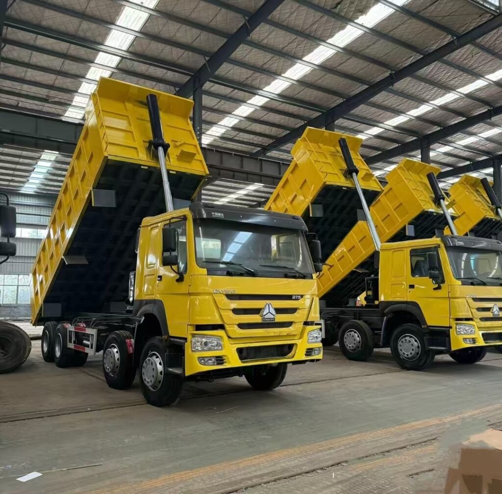 LN Group yellow Howo dump tipper trucks displayed at the 22nd China Liangshan Special Purpose Vehicle Exhibition for export to global markets